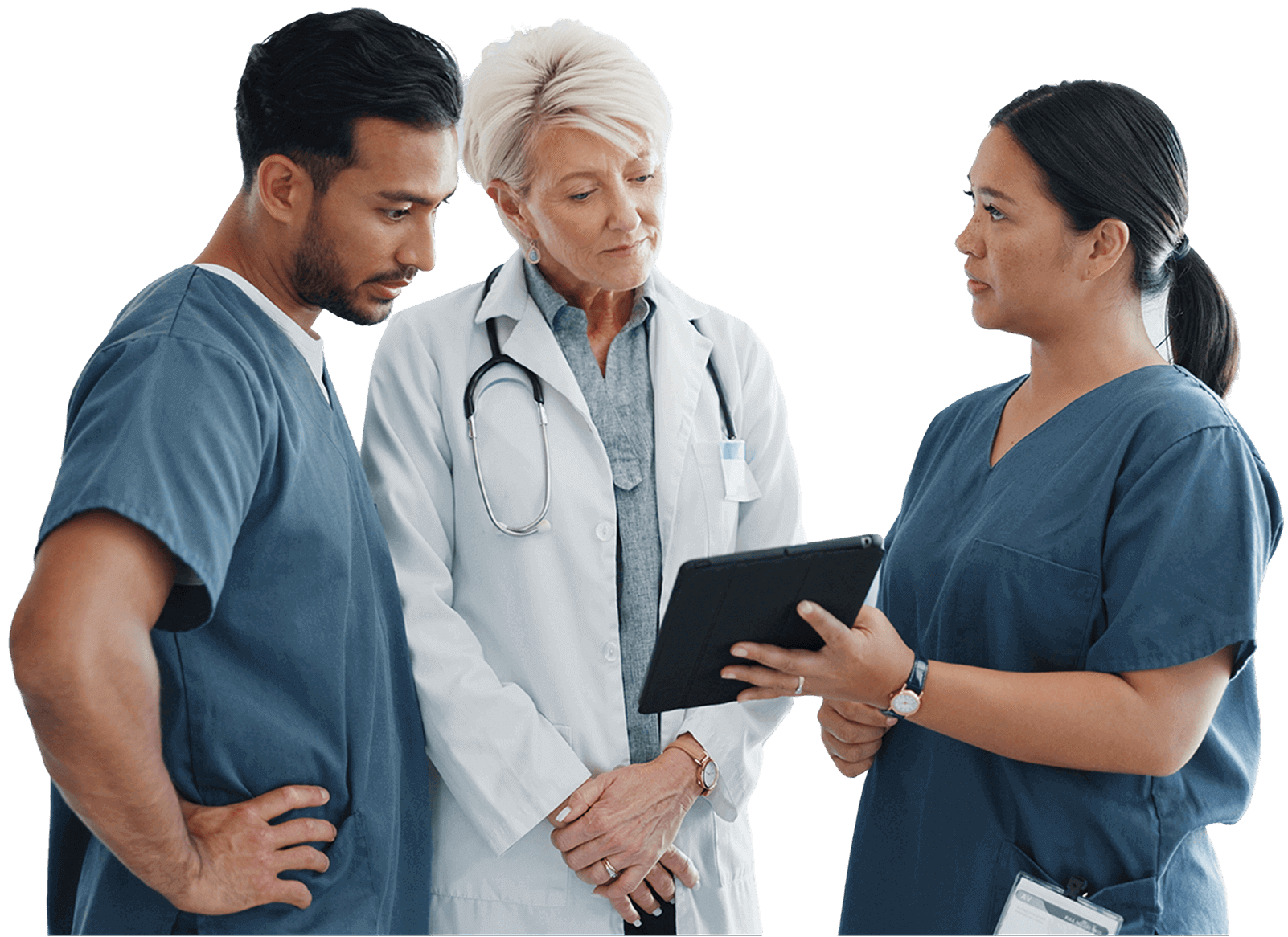 Three healthcare professionals in scrubs and a lab coat discuss information on a tablet.